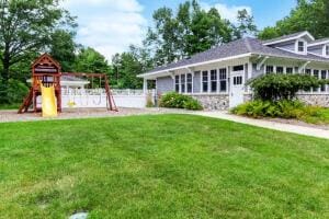 23 Kenneth St, Pentwater, MI 49449 - view of green lawn with a playground
