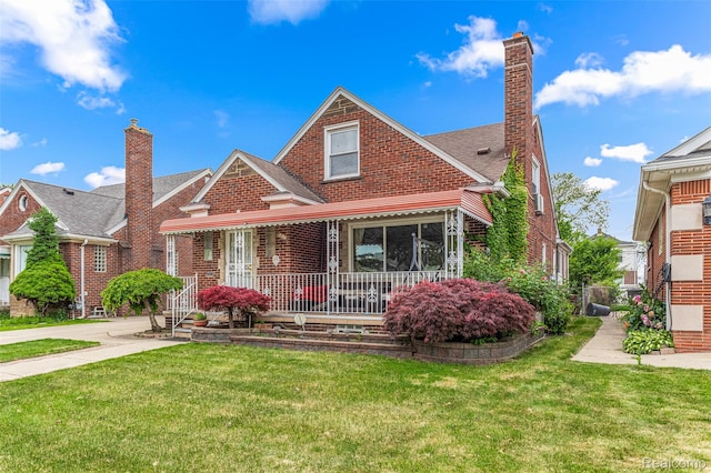 5835 Oakman Blvd, Dearborn, MI 48126 - view of front of property featuring covered porch, brick siding, a front yard, and a chimney