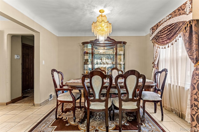 5835 Oakman Blvd, Dearborn, MI 48126 - dining room with light tile patterned flooring, a chandelier, and baseboards