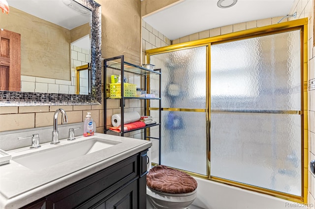 5835 Oakman Blvd, Dearborn, MI 48126 - bathroom with toilet, bath / shower combo with glass door, vanity, and tile walls