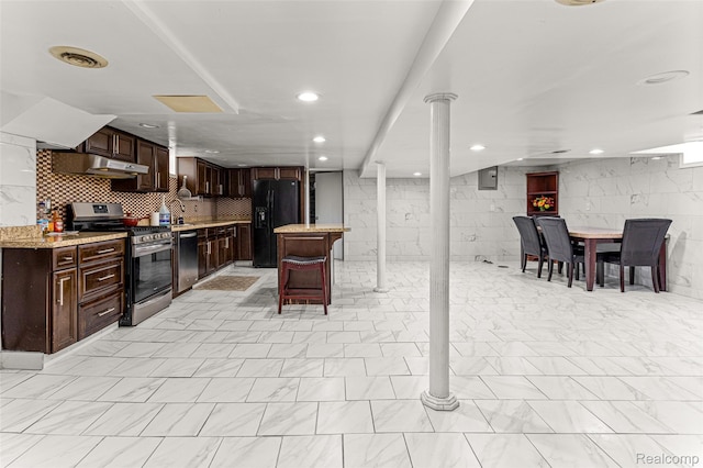 5835 Oakman Blvd, Dearborn, MI 48126 - kitchen with appliances with stainless steel finishes, under cabinet range hood, a breakfast bar, dark brown cabinets, and recessed lighting