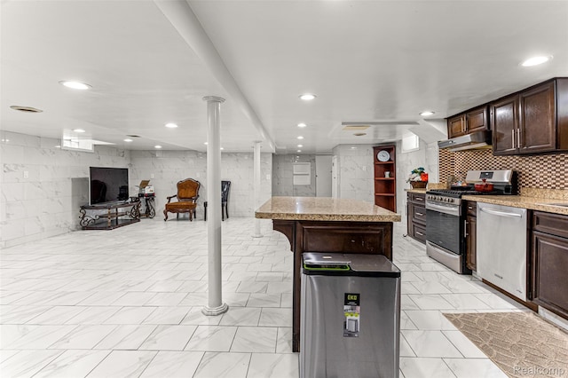 5835 Oakman Blvd, Dearborn, MI 48126 - kitchen featuring stainless steel appliances, light countertops, dark brown cabinets, light marble finish flooring, and recessed lighting