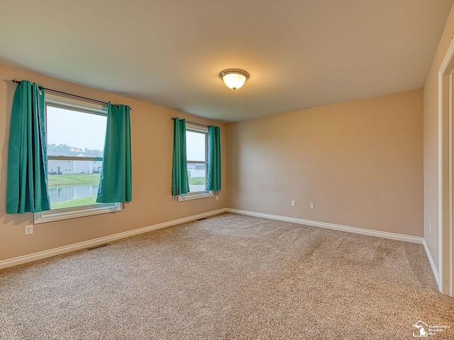 8721 E Park Ridge Cir, Newport, MI 48166 - empty room featuring carpet floors and baseboards