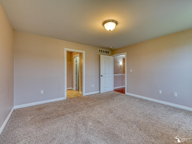 8721 E Park Ridge Cir, Newport, MI 48166 - carpeted empty room with baseboards