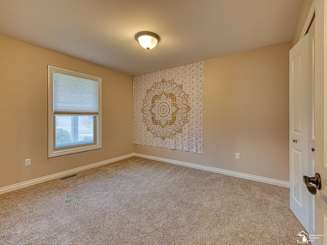 8721 E Park Ridge Cir, Newport, MI 48166 - carpeted spare room featuring baseboards