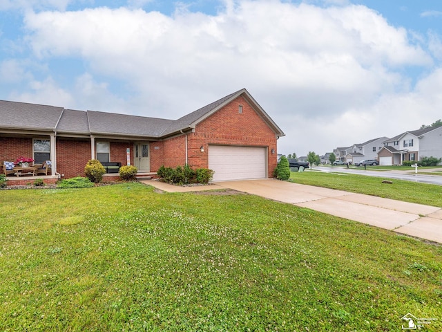 8721 E Park Ridge Cir, Newport, MI 48166 - view of front facade with brick siding, an attached garage, a front yard, driveway, and a residential view