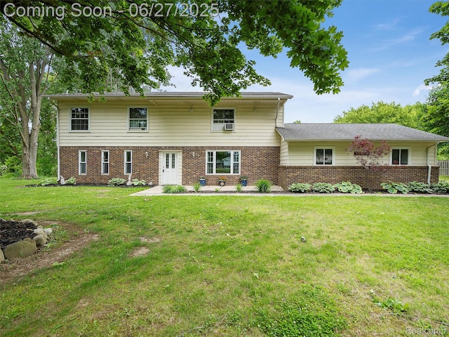 11474 Clairmont Dr, Fenton, MI 48430 - view of front of house with brick siding and a front yard