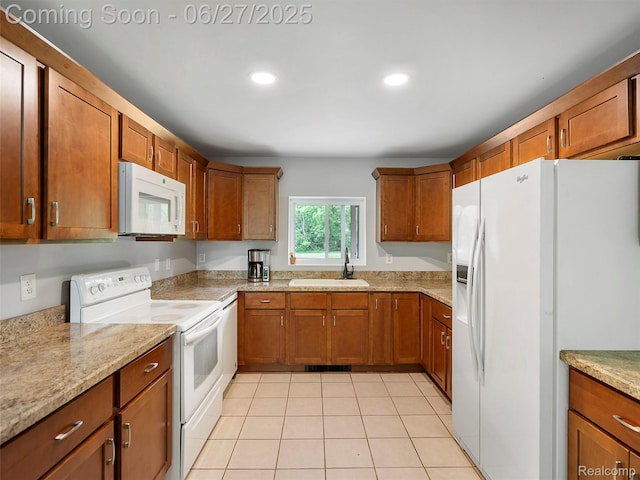 11474 Clairmont Dr, Fenton, MI 48430 - kitchen with white appliances, brown cabinets, and recessed lighting