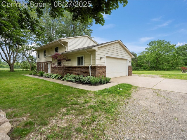 11474 Clairmont Dr, Fenton, MI 48430 - view of front of property featuring brick siding, concrete driveway, a front yard, and a garage