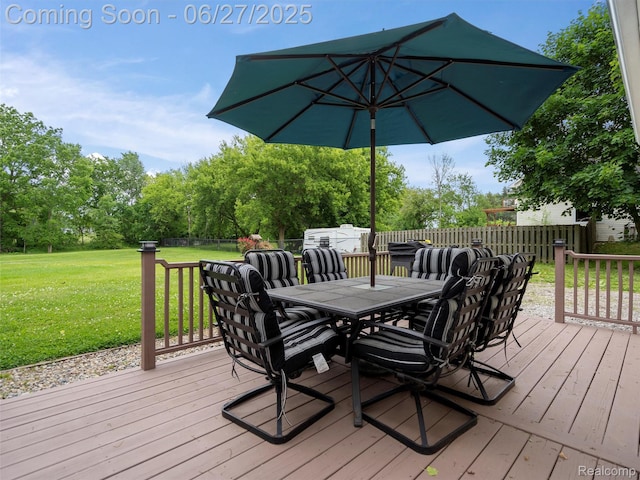11474 Clairmont Dr, Fenton, MI 48430 - wooden terrace featuring outdoor dining space, a lawn, and view of wooded area