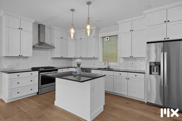 627 Fairview Ave NE Unit 2, Grand Rapids, MI 49503 - kitchen featuring stainless steel appliances, wall chimney exhaust hood, and dark countertops