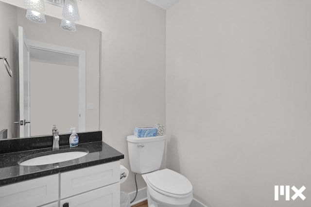 627 Fairview Ave NE Unit 2, Grand Rapids, MI 49503 - half bath with toilet, vanity, and baseboards