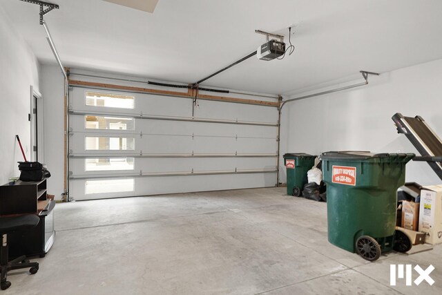 627 Fairview Ave NE Unit 2, Grand Rapids, MI 49503 - garage featuring a garage door opener