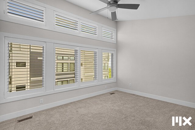 627 Fairview Ave NE Unit 2, Grand Rapids, MI 49503 - carpeted spare room featuring a ceiling fan and baseboards