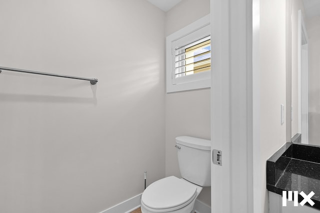 627 Fairview Ave NE Unit 2, Grand Rapids, MI 49503 - bathroom with baseboards and toilet