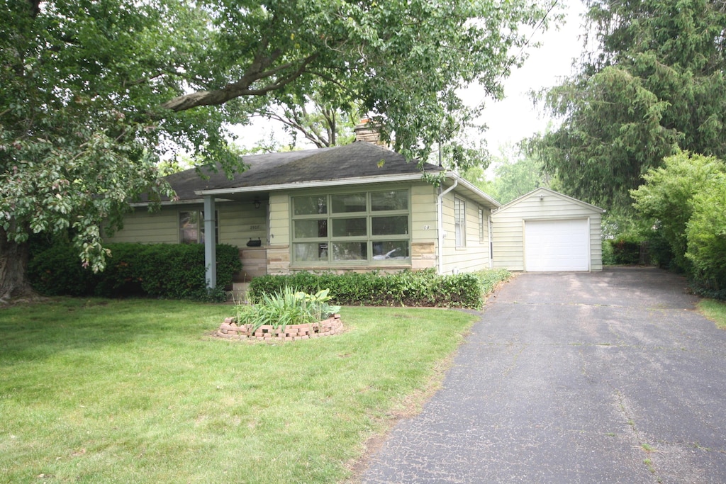 2908 Olney Rd, Kalamazoo, MI 49006 - single story home featuring a detached garage, an outdoor structure, a chimney, driveway, and a front lawn