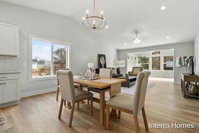 345 Hickory Valley Dr, Kalamazoo, MI 49009 - dining space featuring a chandelier, a ceiling fan, vaulted ceiling, light wood-style flooring, and recessed lighting