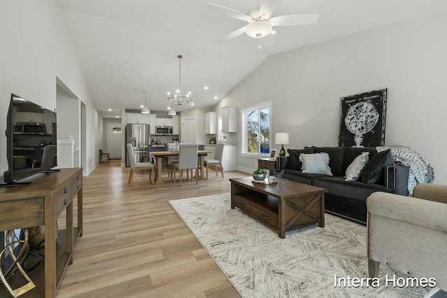 345 Hickory Valley Dr, Kalamazoo, MI 49009 - living area with ceiling fan, light wood-type flooring, a chandelier, high vaulted ceiling, and recessed lighting