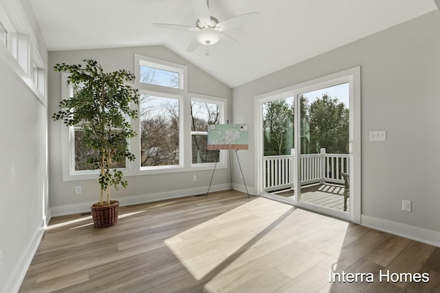 345 Hickory Valley Dr, Kalamazoo, MI 49009 - empty room with a ceiling fan, wood finished floors, vaulted ceiling, and baseboards