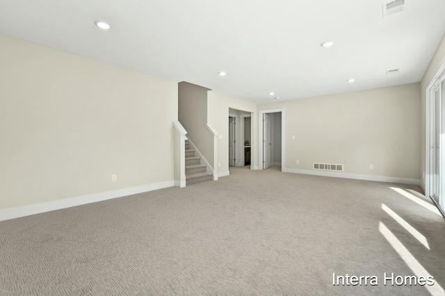 345 Hickory Valley Dr, Kalamazoo, MI 49009 - spare room with stairs, recessed lighting, baseboards, and light carpet