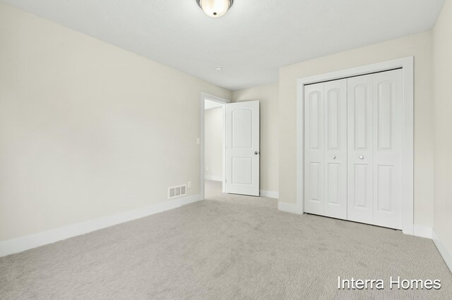 345 Hickory Valley Dr, Kalamazoo, MI 49009 - unfurnished bedroom featuring carpet, baseboards, and a closet