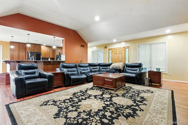 3680 Miller Rd, Ann Arbor, MI 48103 - living room with lofted ceiling, light wood-style floors, and recessed lighting