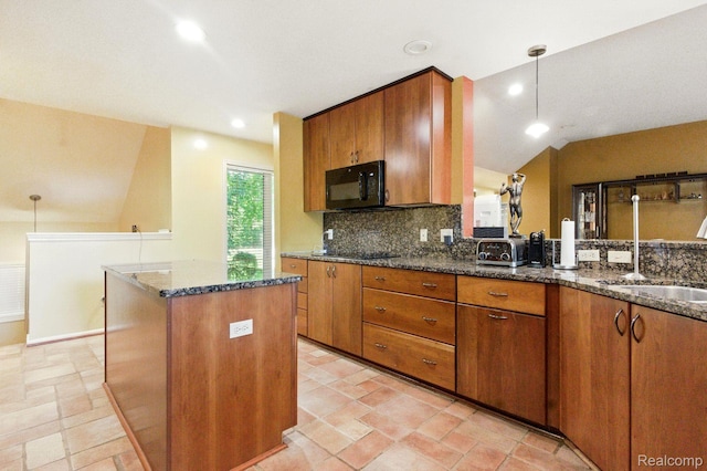 3680 Miller Rd, Ann Arbor, MI 48103 - kitchen with black appliances, brown cabinetry, dark stone counters, decorative backsplash, and lofted ceiling