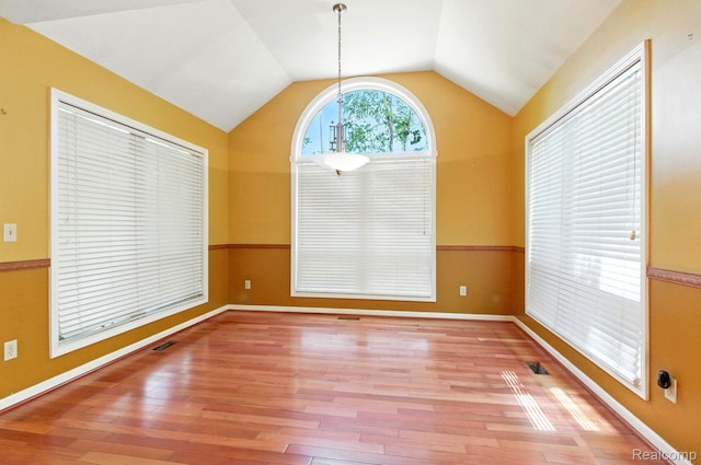 3680 Miller Rd, Ann Arbor, MI 48103 - unfurnished dining area with vaulted ceiling and wood finished floors