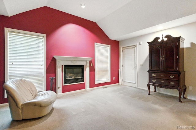 3680 Miller Rd, Ann Arbor, MI 48103 - living area featuring lofted ceiling, carpet, and a premium fireplace