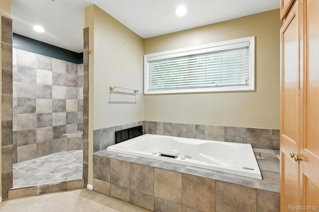 3680 Miller Rd, Ann Arbor, MI 48103 - bathroom featuring a bath, a tile shower, and recessed lighting