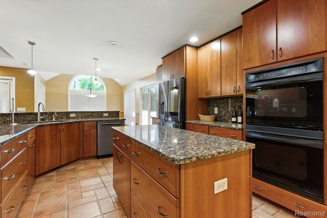 3680 Miller Rd, Ann Arbor, MI 48103 - kitchen with stainless steel appliances, a center island, brown cabinetry, lofted ceiling, and recessed lighting