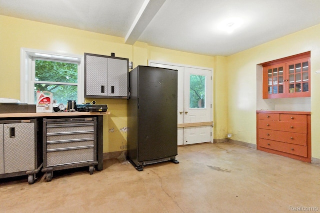 3680 Miller Rd, Ann Arbor, MI 48103 - kitchen with freestanding refrigerator and white cabinets