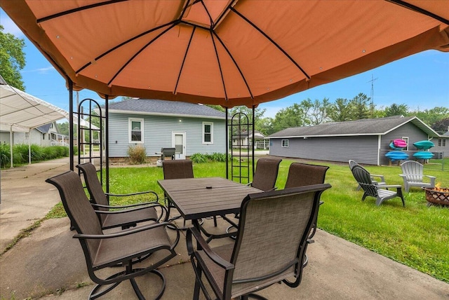 4940 Pottawatamie Path, Watervliet, MI 49098 - view of patio with outdoor dining space and a fire pit