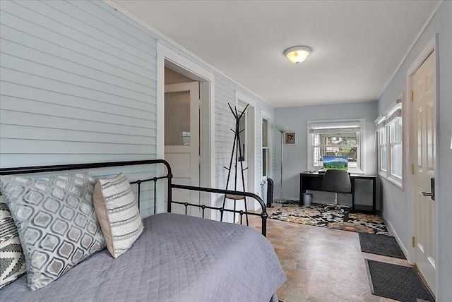 4940 Pottawatamie Path, Watervliet, MI 49098 - bedroom featuring stone finish floors, baseboards, crown molding, and a desk