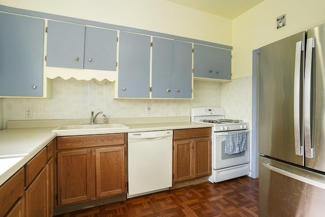 1386 W Broadway Ave, Muskegon, MI 49441 - kitchen featuring white appliances, a sink, decorative backsplash, and light countertops