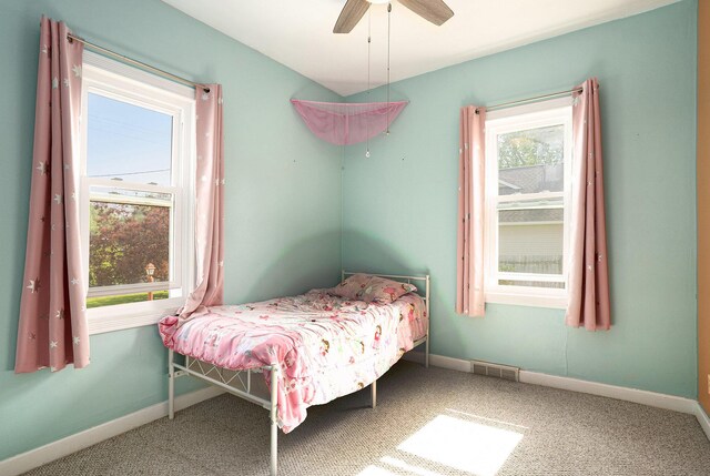 1386 W Broadway Ave, Muskegon, MI 49441 - carpeted bedroom featuring baseboards and ceiling fan