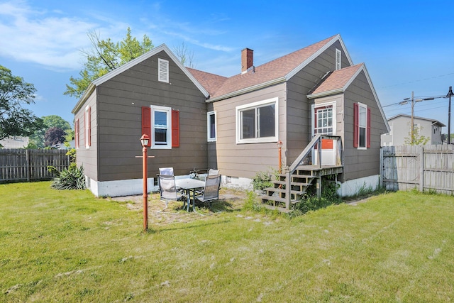 1386 W Broadway Ave, Muskegon, MI 49441 - back of property featuring a chimney and a shingled roof