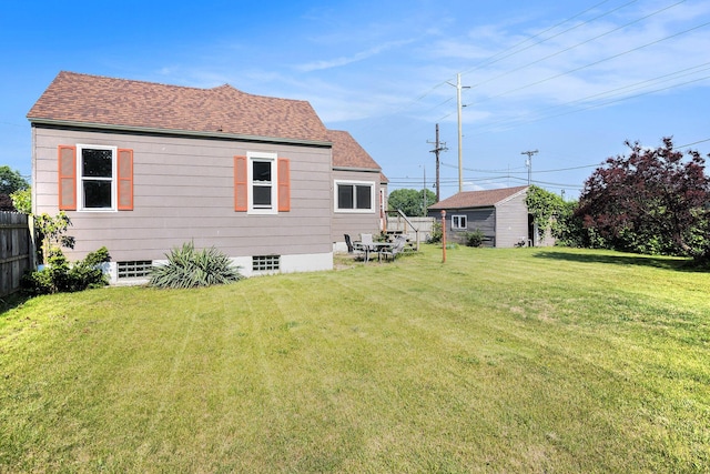 1386 W Broadway Ave, Muskegon, MI 49441 - back of property featuring a shingled roof