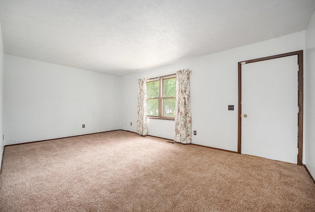 6390 Celery St, Kalamazoo, MI 49048 - carpeted empty room with a textured ceiling