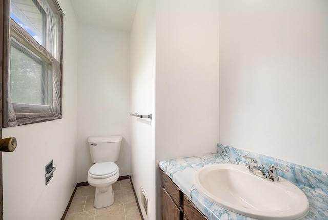 6390 Celery St, Kalamazoo, MI 49048 - half bath featuring toilet, vanity, tile patterned flooring, and baseboards