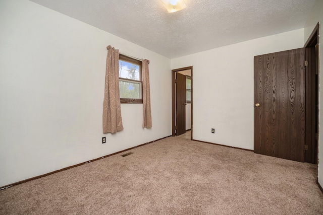 6390 Celery St, Kalamazoo, MI 49048 - carpeted spare room with a textured ceiling and baseboards