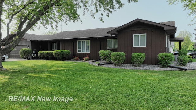 3257 N Christy Way, Saginaw, MI 48603 - ranch-style home featuring board and batten siding, a garage, a front lawn, and roof with shingles