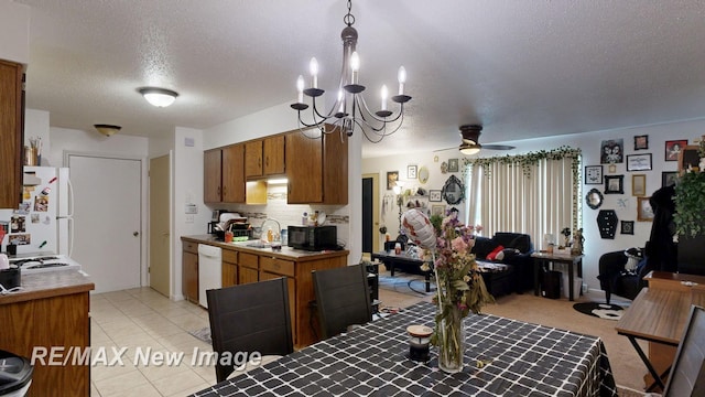 3257 N Christy Way, Saginaw, MI 48603 - kitchen featuring white appliances, a textured ceiling, a chandelier, a ceiling fan, and brown cabinetry