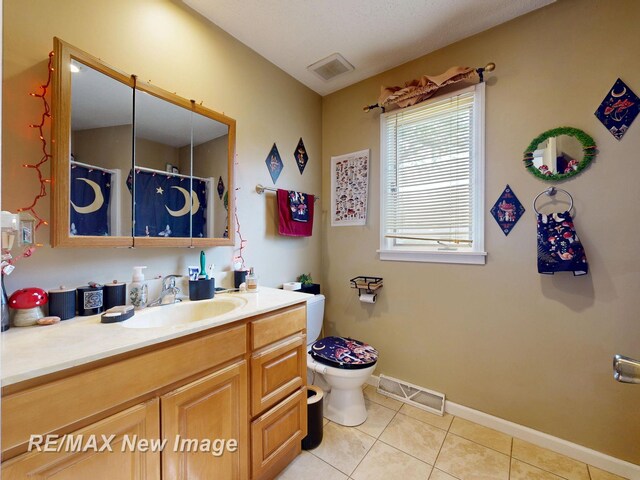 3257 N Christy Way, Saginaw, MI 48603 - full bath with toilet, vanity, tile patterned flooring, baseboards, and a shower with curtain