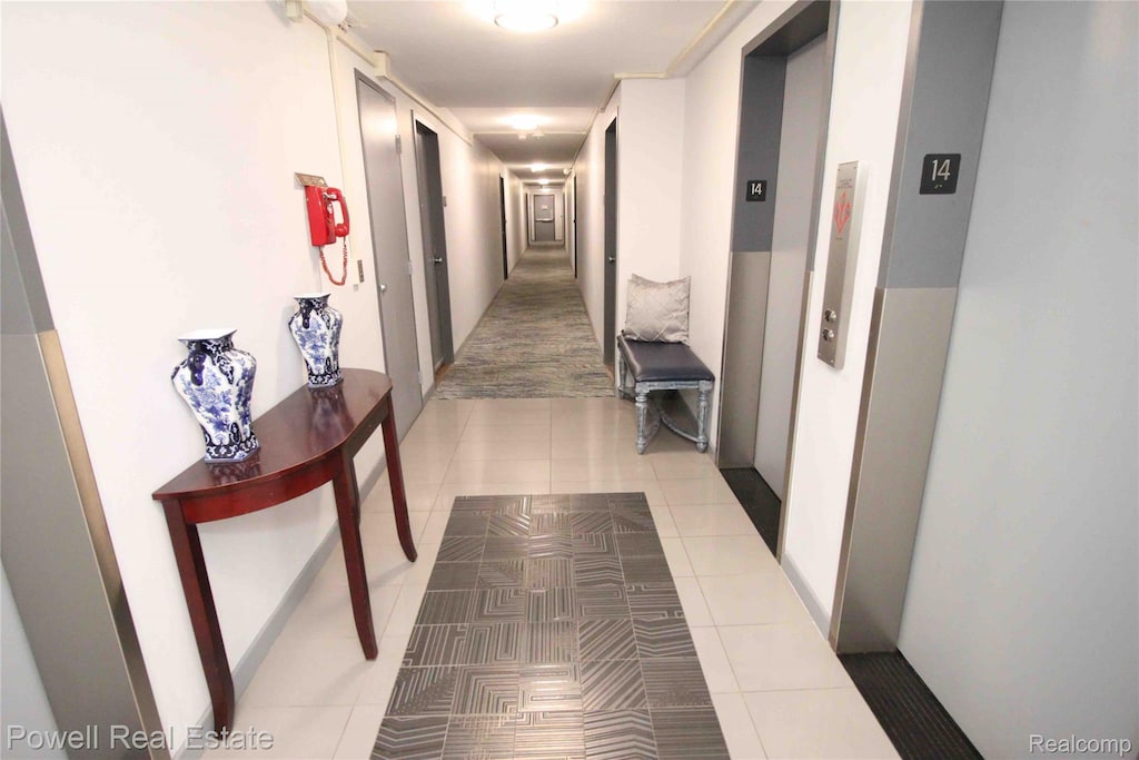 8900 Jefferson Ave Unit 220, Detroit, MI 48214 - hall with elevator and light tile patterned floors