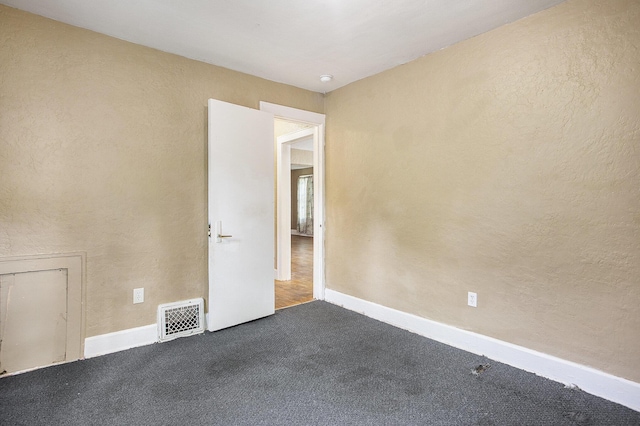 1767 W Michigan Ave, Battle Creek, MI 49037 - carpeted empty room featuring baseboards
