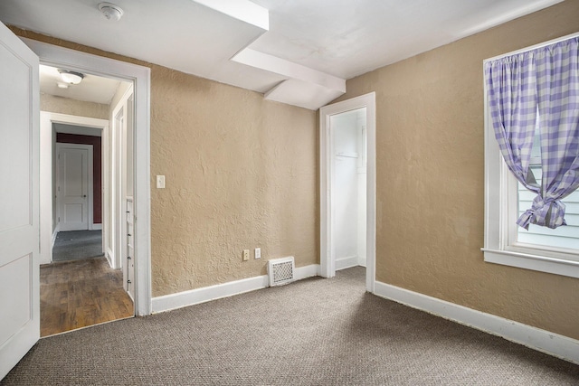 1767 W Michigan Ave, Battle Creek, MI 49037 - carpeted spare room featuring a smoke detector, a textured wall, and baseboards