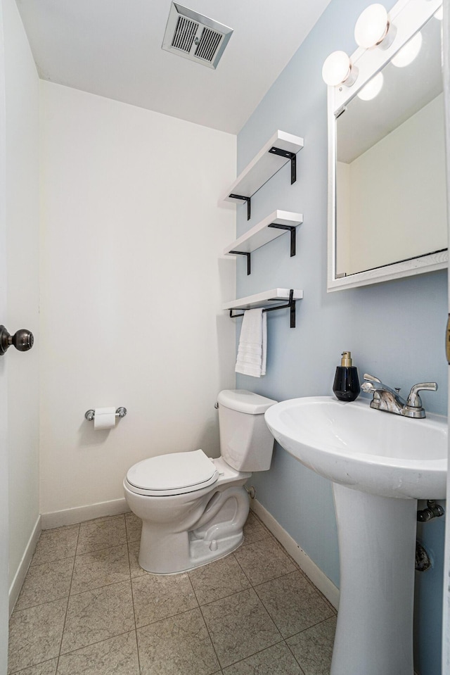2149 Fair St, Ann Arbor, MI 48103 - bathroom with toilet, baseboards, and tile patterned floors