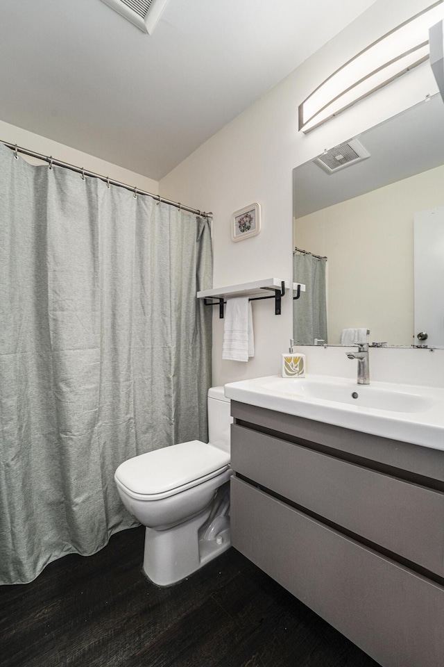 2149 Fair St, Ann Arbor, MI 48103 - full bath featuring toilet, wood finished floors, and vanity