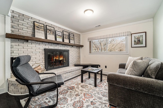 2149 Fair St, Ann Arbor, MI 48103 - living room with a brick fireplace, baseboards, and ornamental molding